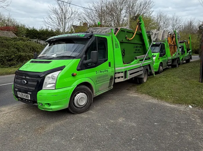 Real DJ Recycling fleet of green skip lorries