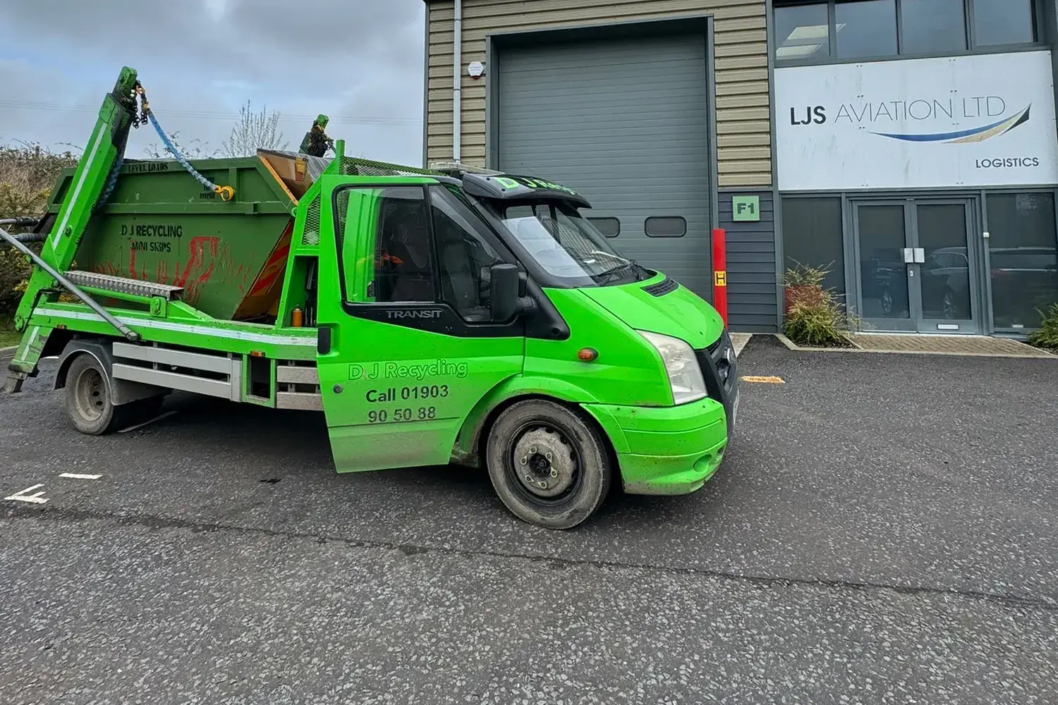 DJ Recycling skip lorry at a business unit