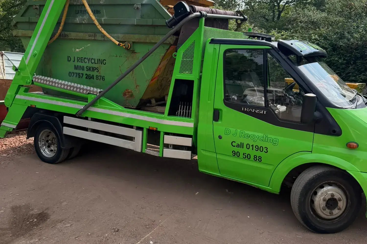 DJ Recycling skip lorry carrying stacked mini skips