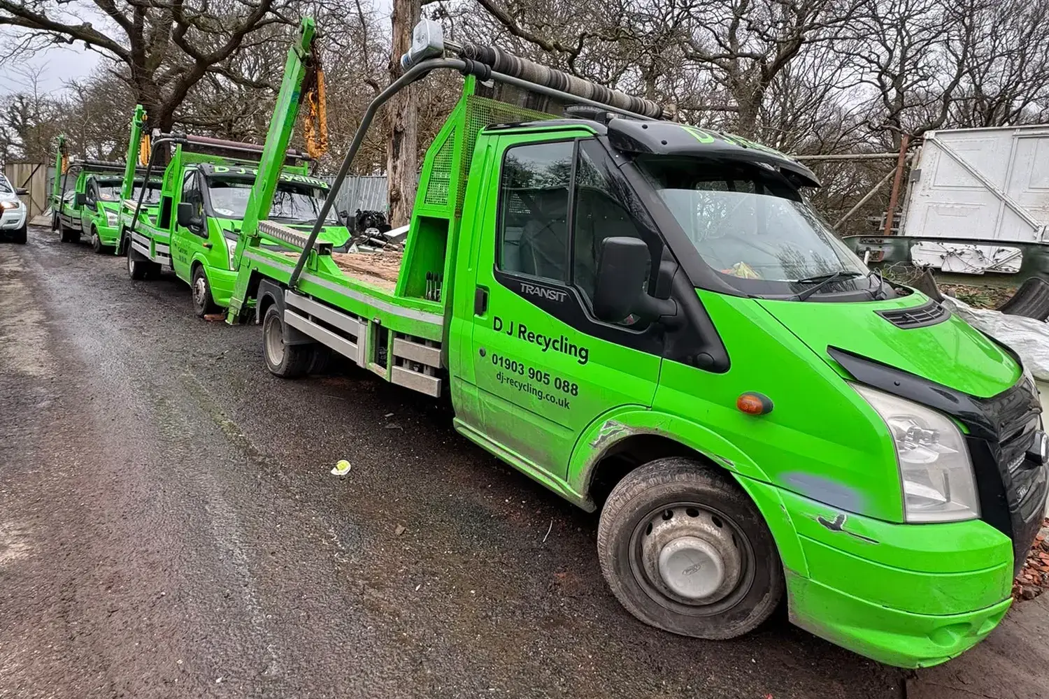 DJ Recycling skip lorry fleet lined up at the yard